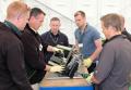 An indoor training session on John Deere's Quick Adjust (QA) cutting units
