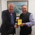 Chris Biddle (left) presents Wisden to Roger Lane Nott