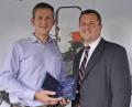 Tim Lane of TH White Ltd receives the Ransomes sales award from Sales Director Rupert Price