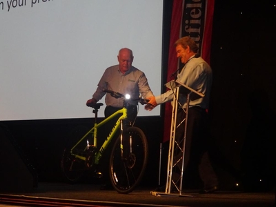 Colin McClandish hands over bike