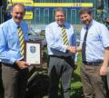 L-R Dick Spencer & Andy Coles from C&O Tractors receive the award for Dealer of the Year from New Holland’s Graham Gleed