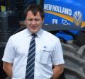 Lloyd Ltd Agricultural Sales Representative, George Lowis, at the Penrith branch with one of the latest New Holland T7 models