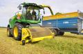 Silage contractor Thomas McKelvey driving his new John Deere 8800 self-propelled forage harvester, with John Deere territory manager Will McKnight in the passenger seat