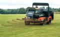 The Turfco 1550 WideSpin topdresser paired with the new Jacobsen Truckster XD