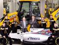 JCB Chairman Lord Bamford (centre left) and JCB CEO Graeme Macdonald pictured with JCB apprentices (l-r) Kyle Hare , Charlie Trotter, Jade Holmes, Chelsea Saunders, James Mohan and Daniel Malbon at the announcement of the new partnership agreement between JCB and Williams Martini Racing
