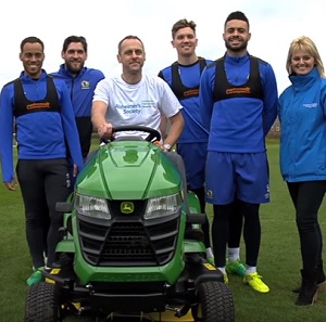 HMP Kirkham prison officer Andy Maxfield at Blackburn Rovers' training ground with some players
