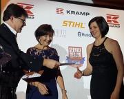 A charity raffle was held for Maggie's at the Awards. Here Service Dealer owner Duncan Murray-Clarke and Trish Biddle present a prize to Emma McArthur