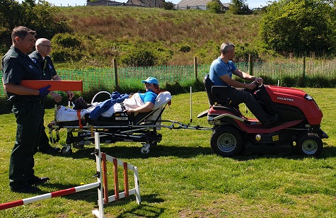 Mary Grant being rescued by the Countax garden tractor. Photograph courtesy of Debbie Clarke who runs KDW Doggie Day Care 