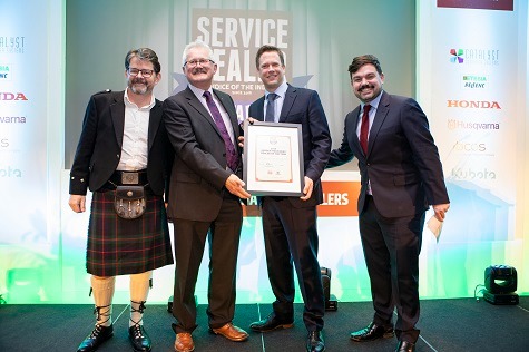 Kevin Ashmore, retired UK Commercial Landscape & Groundcare Manager at Husqvarna UK (2nd from left) presents Jason Nettle of Winchester Garden Machinery with their Garden Machinery Dealer of the Year award at 2019's Service Dealer Awards