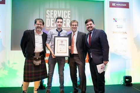 Martin Tyler, Business Development Manager at Kubota UK (2nd from right) presents Ifan Davies of Arwel's Agri Services, with their Apprentice of the Year award at 2019's Service Dealer Awards