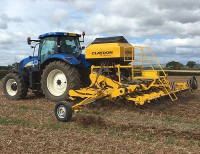 A New Holland T6090 tractor operating with a Claydon Hybrid drill