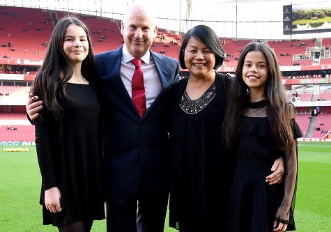 Steve Braddock and his family on the pitch at Arsenal