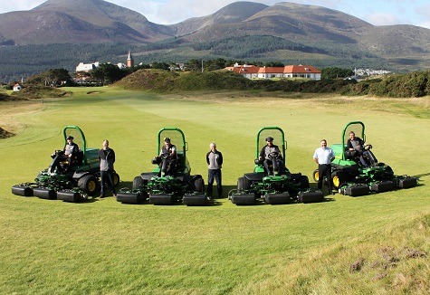 (Standing, left to right) John Deere turf strategic account manager Richard Charleton, Royal County Down links manager Eamonn Crawford and Johnston Gilpin dealer sales manager Ricky Neill