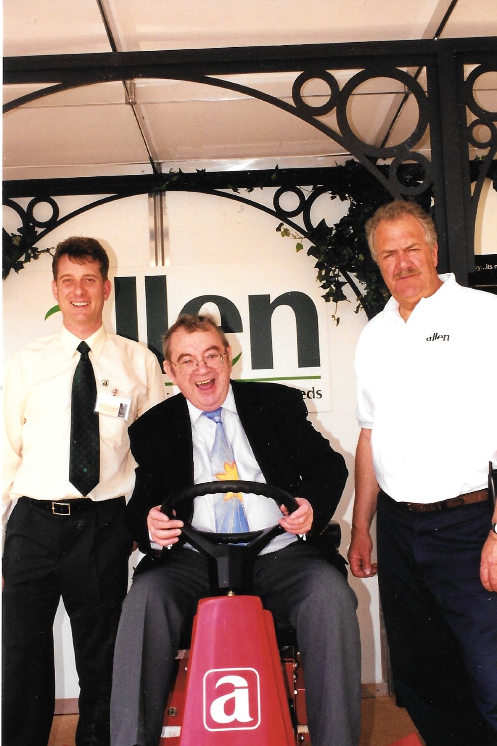 Peter Bateman (l) and Lance Bassett with weatherman Ian McCaskill on the Allen stand at Chelsea Flower Show