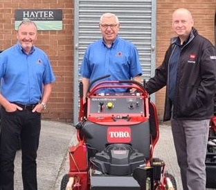 Steve Halley, managing director at Cheshire Turf Machinery, centre, with Peter McGreevy, sales director, left, and Mark Woodward, service director