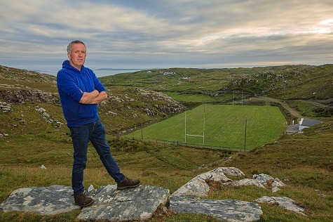 On top of the world. Groundsman Eamon Heanue with the southern view of Inishturk GAA pitch behind him 