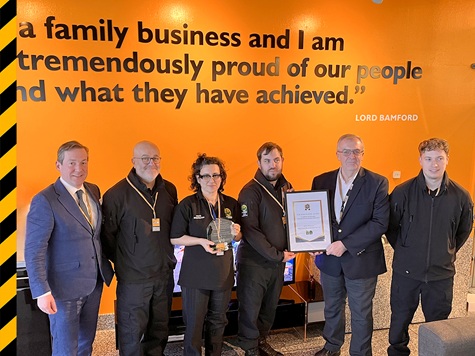 Charles Stephenson, London office director at JCB, Chris Piggott, detective sergeant, NCATT and his wider NCATT team - award presented by Roy Kerr, JCB group service director