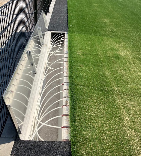 A network of pipes is installed beneath the pitch