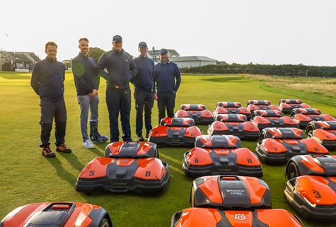 Royal Porthcawl course manager Ian Kinley (centre), who passed away earlier this year, with Husqvarna’s Jonathan Snowball and the robotic mower fleet used at the AIG Women’s Open.