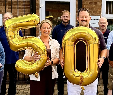 Staff celebrate the 50th anniversary